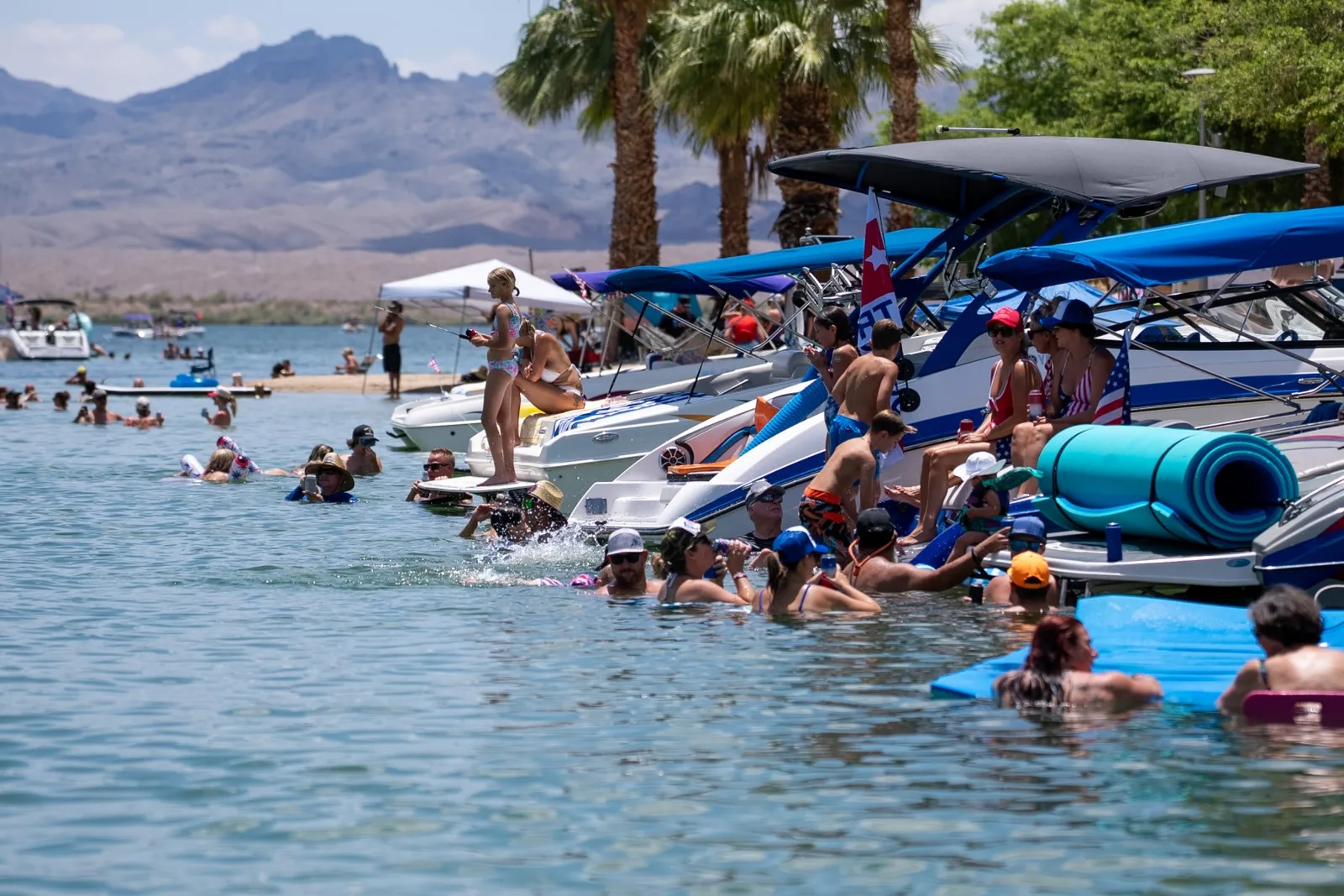Boaters and swimmers enjoying a sunny day on Lake Havasu near the Bridgewater Channel