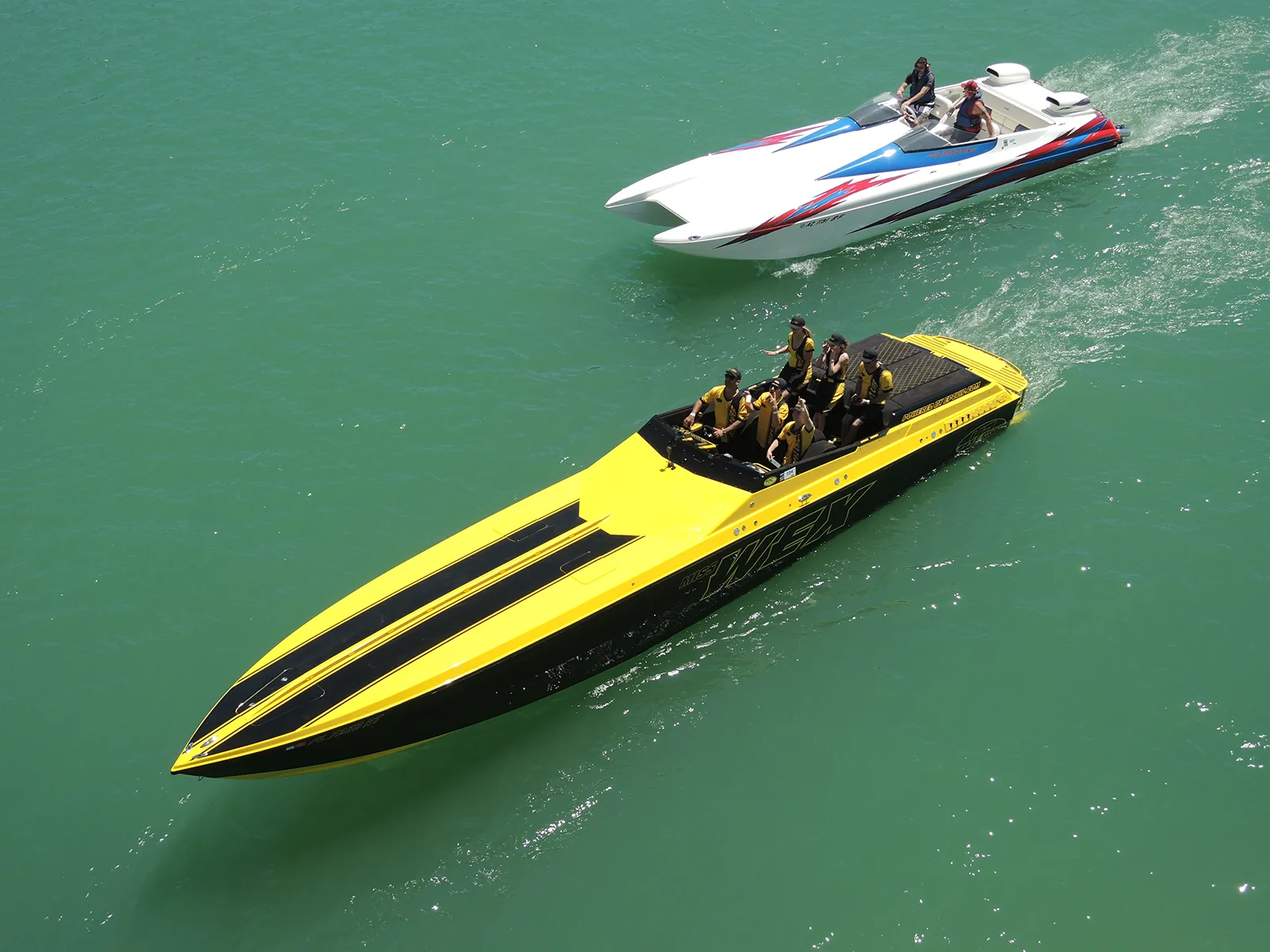 High-performance offshore powerboats racing during the Desert Storm Poker Run on Lake Havasu